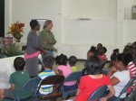 Marva Paris-Roberts, Project Officer for the Nevis Library Service introduces Mario to a group of students who gathered at the Nevis Cultural Centre for a reading of A Caribbean Journey From A to Y (Read and Discover What Happened to the Z).