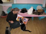 Mario shows A Very Smart Cat to some interested residents at Animalkind.