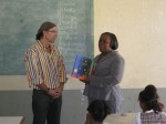 Ms. Dorothea Nelson, Chief Librarian, Antigua Public Library thanks author Mario Picayo for her signed copies of A Caribbean Journey from A to Y (Read and Discover What Happened to the Z).