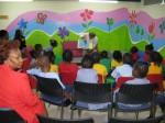 Mario reads to the children from "A Caribbean Journey"