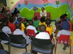 Mario reads to the children from "A Caribbean Journey"