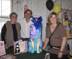 Illustrator Yolanda Fundora, author Mario Picayo, "Cat Tales" cat and her smiling new owner Sharon Eisen
