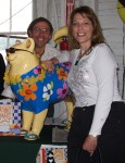 Mario Picayo with the ecstatic raffle winner of the sunglassed and very well travelled Kitty Buffet.