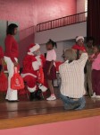 Mario, publisher, writer, photographer . . .captures the moment. To the right of Santa Claus, Mrs. Cecile de Jongh, First Lady of the U.S. Virgin Islands.