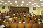 View from the back of the auditorium. Full house, and Santa on stage, greeting and listening to wishes of all sizes. Pearl B. Larsen Elementary School, St Croix.